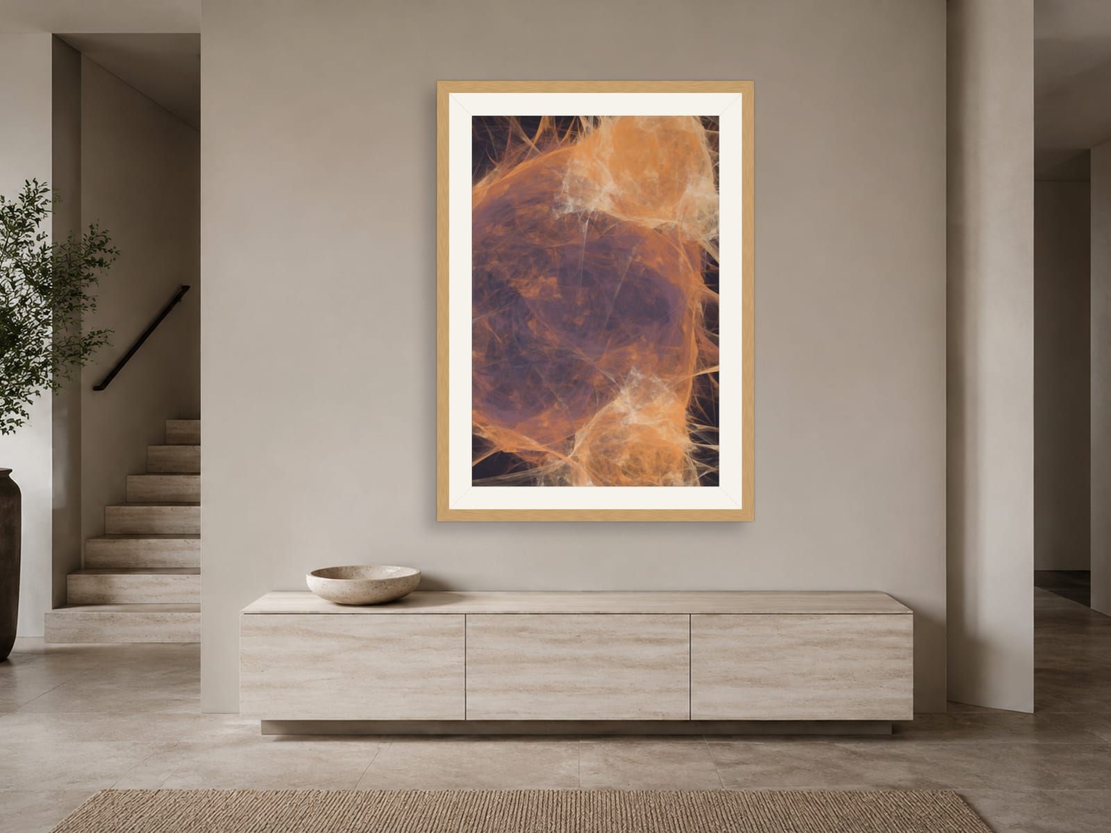 Sketches No. 016, an orange and plum fractal flame print in a natural oak frame, displayed in a warm boho-styled living room with a blush-pink wall.